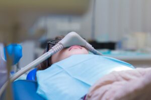 anxious patient undergoing sedation dentistry to easy anxiety