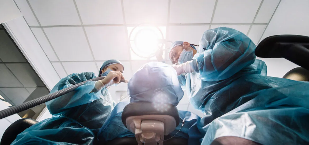 dentists performing a root canal procedure