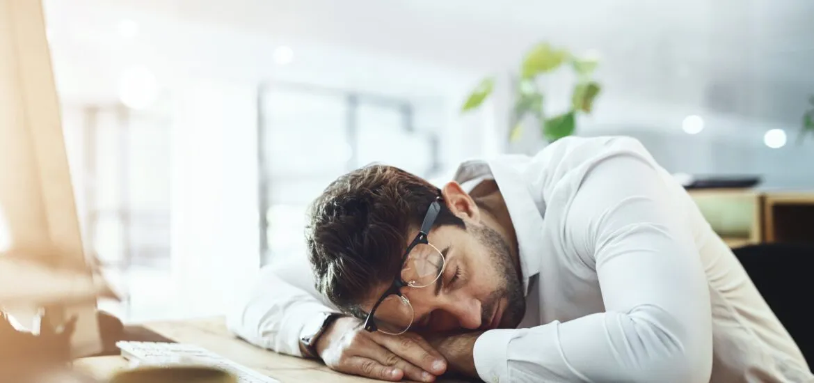 man passed out at desk, sleep disorder