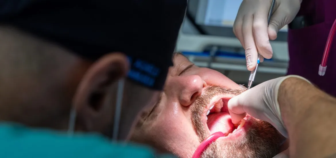 dentist performing an emergency tooth removal